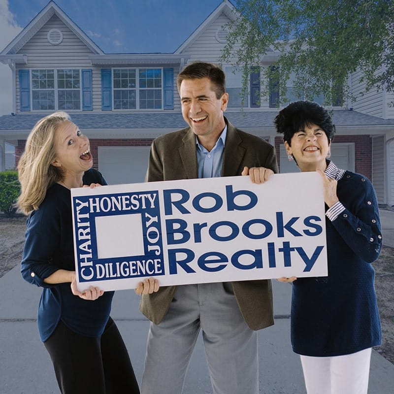 rob brooks team in front of house