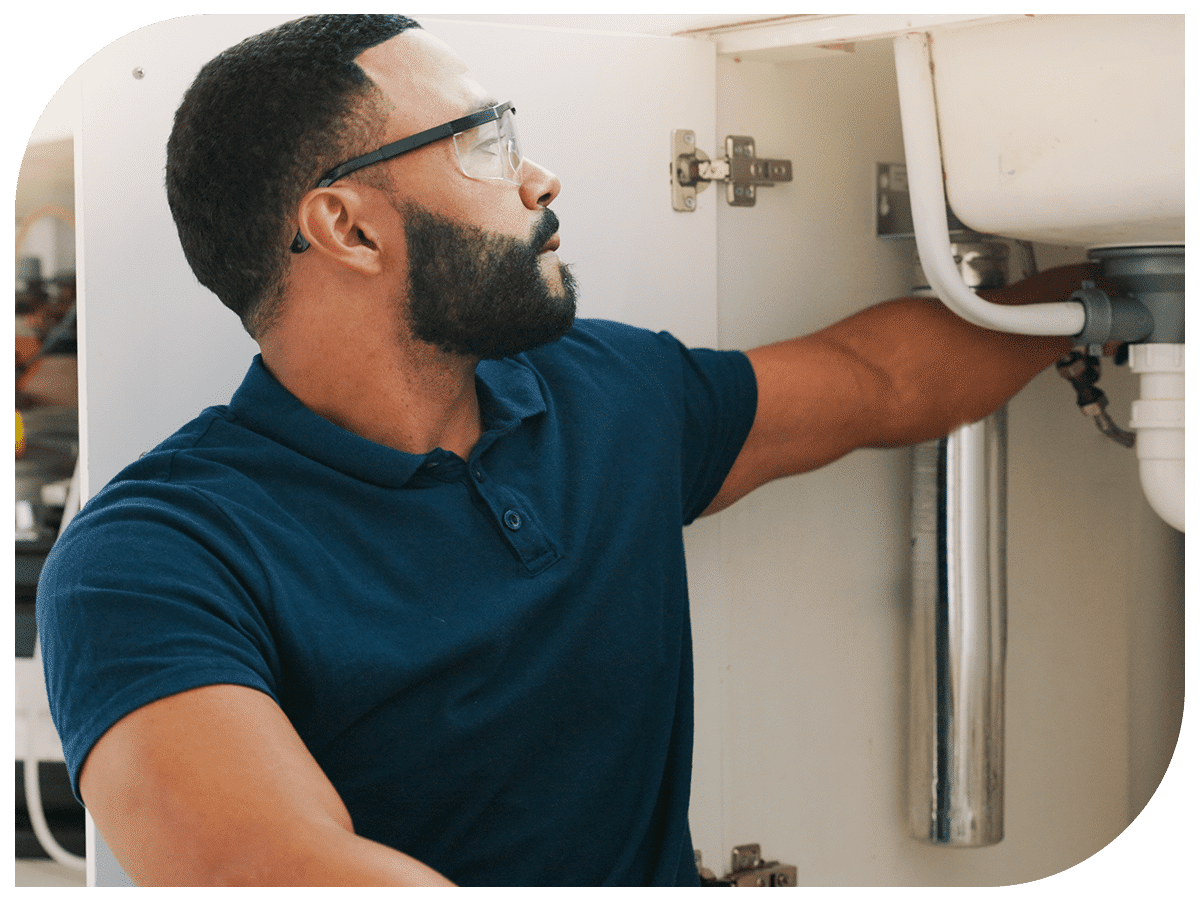 handyman working on sink